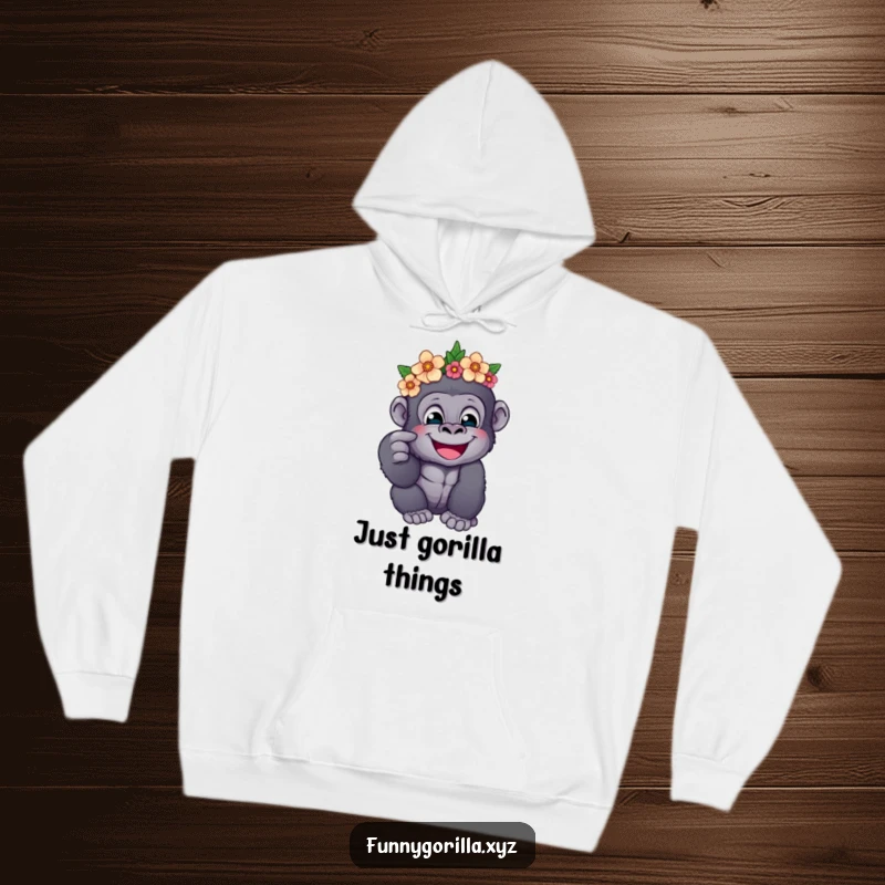 Funny hoodie with a happy gorilla wearing a flower crown, playfully poking its cheek, perfect for cozy and humorous wear.